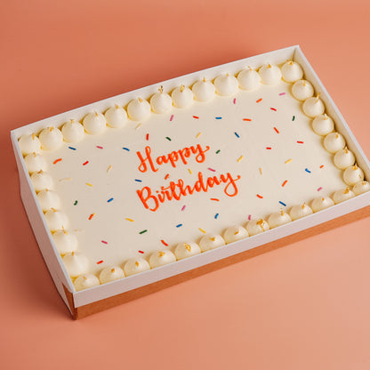 Rectangle Sheet Party Cake in White, wiht sprinkles and bright piped message &